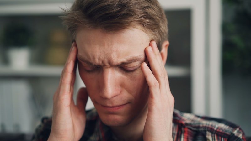 Person finding relief from migraine